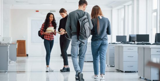 Clean room. Group of young people walking in the office at their break time.